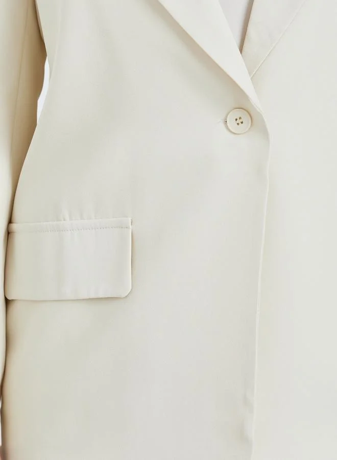 ستايلي بليزر كريمي واسع بياقة مدببة